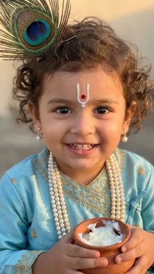 Cute Baby Krishna Holding Makhan HD Portrait